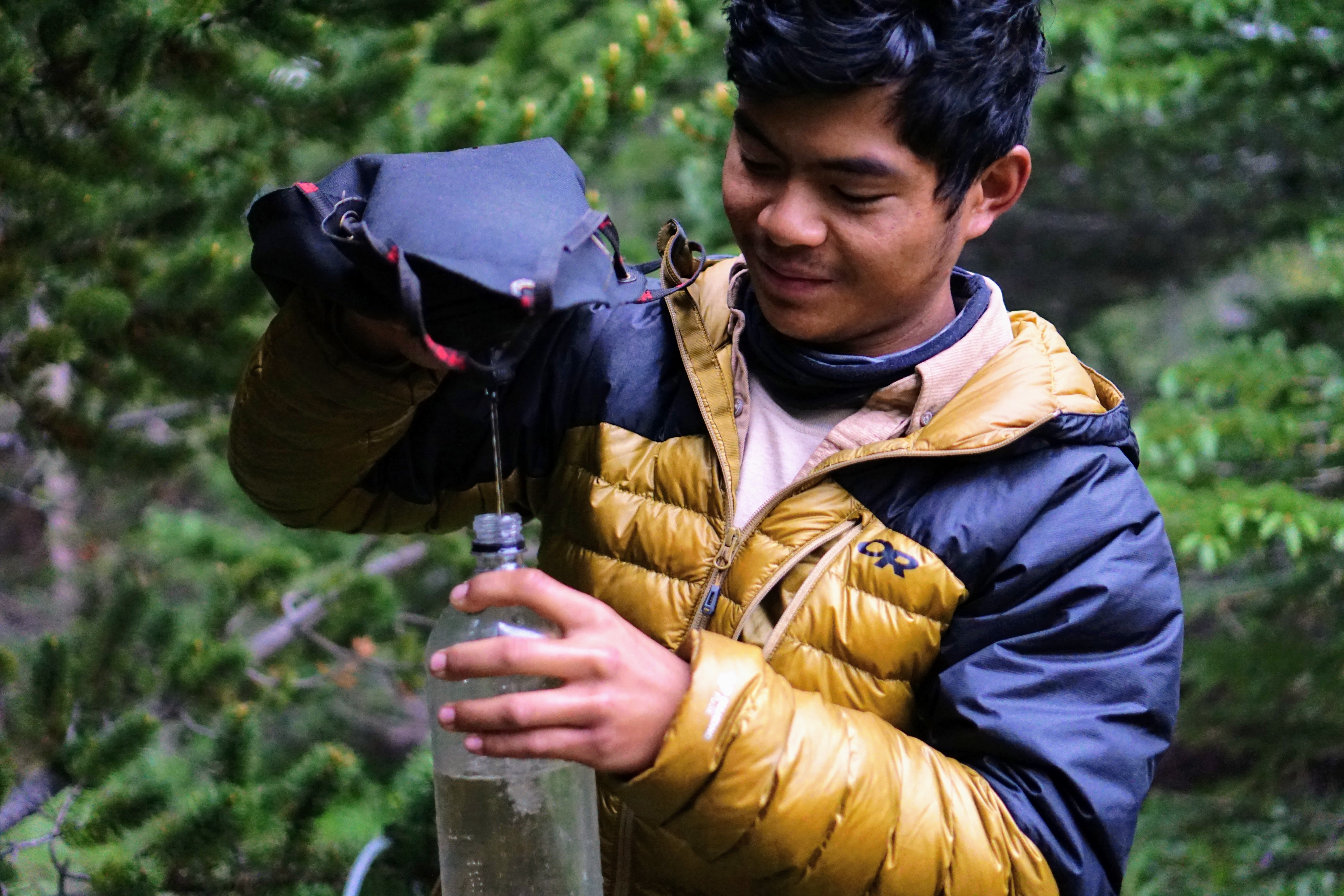 Crew member fills up a water bottle